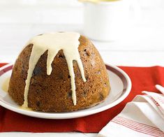 a bundt cake with icing on a white plate