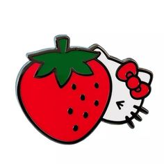 a hello kitty strawberry pin sitting on top of a white surface