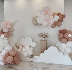 balloons are arranged in the shape of moon and clouds