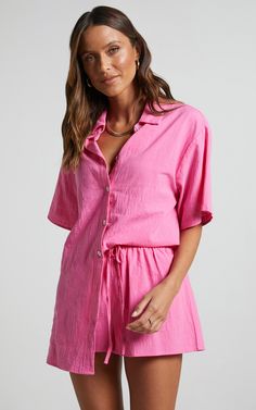 Make a statement this season in the Vina Del Mar Button Up Shirt And Shorts Two Piece Set In Hot Pink. The playful co-ord shorts and matching short sleeve shirt are perfect for casual days out or beachwear vibes. Made from soft linen, this pink ensemble is not only trendy but also comfortable to wear all day long.With a classic collar and button-up design, you can easily dress it up or down depending on the occasion. Perfect for autumnal weather too! Don't miss out on adding this must-have set t Europe Summer Outfits, Coral Shirt, Vina Del Mar, Shirt And Shorts Set, Coord Set, Pink Outfit, Short Sleeve Button Up