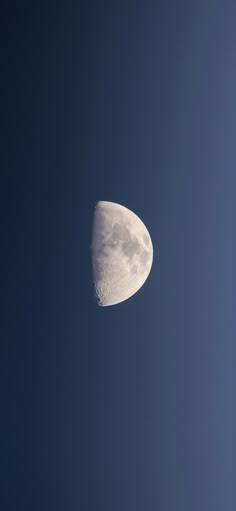 the moon is in the blue sky with no clouds