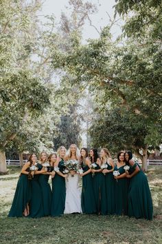 a group of bridesmaids in green dresses