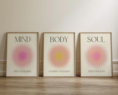 three framed posters with the words mind, body and soul on them in front of a white wall