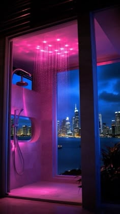 a shower head in the middle of a room with city lights on it's walls