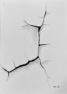 a black and white photo of cracks in the wall