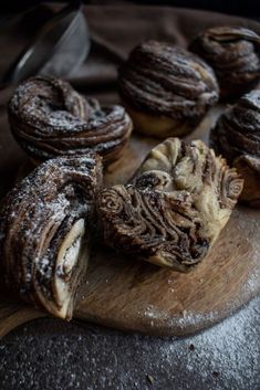 some pastries are sitting on a cutting board