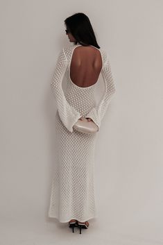 Cool breeze summerThe JULIA Crochet Open Back Maxi Dress is a captivating blend of elegance and allure. Featuring a sophisticated turtle neckline and long sleeves, this dress offers a classic front view. The open back design adds a striking contrast, creating a stunning silhouette. Crafted with intricate crochet detailing, the dress flows gracefully to a maxi length, making it perfect for any special occasion where you want to make a lasting impression. Elegant Long Sleeve Maxi Dress With Back Opening, Elegant Beach Maxi Dress With Back Opening, Elegant Maxi Dress With Back Opening For Beach, Elegant Beach Dresses With Back Opening, Long Sleeve Backless Dress For Date Night, Fitted High Neck Beach Dresses, Elegant Long Sleeve Maxi Dress For Brunch, Chic Fitted Backless Long Sleeve Dress, Elegant Long Sleeve Backless Dress