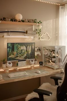 a desk with a computer monitor, keyboard and mouse on it in front of a window