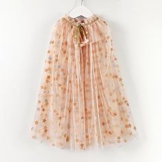 PRICES MAY VARY. ✨Princess Costume Cape for Girls: Sparkly and dreamy, this costume cape is as though the touch of a fairy godmother has made it. This girl's princess cape is sure to add glamour to any outfit for play, a birthday outfit or holiday dress. ✨Magic in the Details: Little girls princess cape comprises a layered apricot color tulle fabric that feature silver stars all over that shimmer in the light and will never shed. Cape has glimmering irisdescent sequined trims attached along the Kawaii Costumes Halloween, Princess Party Outfit, Fairy Cape, Princess Cloak, Diy Princess Costume, Fairy Godmother Costume, Princess Cape, Cloak Dress, Dress Up Clothes