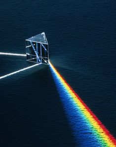 an image of a prism that appears to be in the water with light coming from it