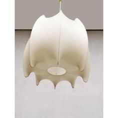 a white light fixture hanging from the ceiling