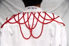 PRODUCT DETAILSWe sourced this white shirt from the second-hand clothing market in New Delhi, India, and reimagined it by taking it apart and hand stitching red crystal beads to the shoulders and cuffs. The glass crystal beads are hand sewn as necklaces. This is a unisex or genderless shirt with raw edge details. This is an UPCYCLED shirt. MEASUREMENTS- Chest 27"- Length 31"MATERIAL- Glass- CottonCAREProfessional dry clean. AVAILABILITYOne of a kind. Only One is available.SHIPPINGShips in 3-4 bu 89s Bead Shirt, Rochester Couture Shirt, Hand Sewing Shirts, Upcycled Shirt, Clothes Embroidery Diy, Beaded Shirt, Creative Clothes, Upcycle Shirt, Diy Fashion Hacks