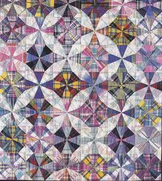 an abstract quilt with many different colors and shapes