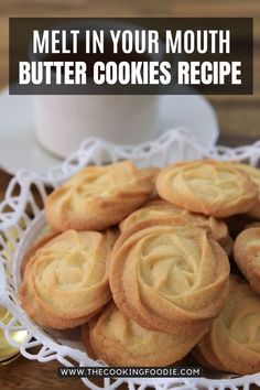 some cookies are in a white bowl on a wooden table with the words melt in your mouth butter cookies recipe