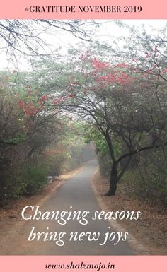 a road with trees and flowers in the background that says changing seasons bring new joy