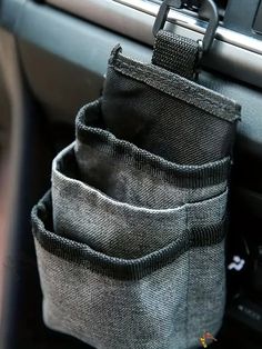 the pocket is holding two items in it's holder on the car dash board