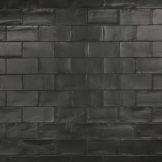 a black and white photo of a brick wall