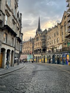 a cobblestone street in an old european city