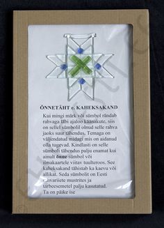 an ornament in the shape of a snowflake is displayed on a card