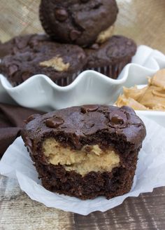 two chocolate muffins with peanut butter in the middle