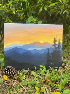 an acrylic painting of mountains with pine cones in the foreground and green leaves on the ground