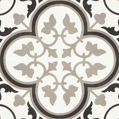 a black and white tile with an ornate design