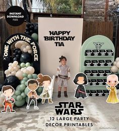 a star wars party with balloons and decorations, including an inflatable birthday sign