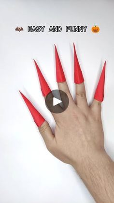 a hand with red fake nails on it's fingers and the words easy and funny