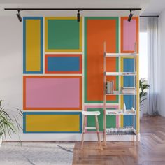 a colorful wall mural in the living room