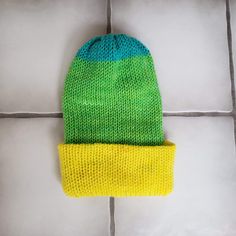 This super soft and plush hat is made from acrylic gauge 4 worsted yarn. The material is 100% acrylic and feels very soft. This hat will fit a medium to large adult, pending your head size. Unstretched it is 13 inches tall with the brim down and 7.5 inches wide. It is very stretchy so it can stretch to be about 12 inches wide so it will fit a variety of heads.  It is a regular knitted pattern, double walled for an extra layer of warmth. It can be worn as a more slouchy beanie style or pulled dow Knitted Acrylic Beanie Cap, Acrylic Knitted Beanie Cap, Green Soft Knit Hat For Cold Weather, One Size Fits Most Acrylic Cap, Blue Acrylic Hat, One Size Fits All, One Size Acrylic Cap, Blue Acrylic Hat, One Size, Blue Acrylic Hat One Size, Blue Acrylic Hat