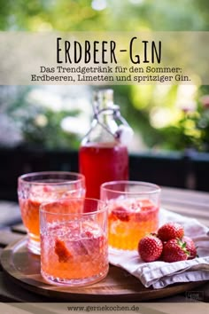 the cover of an article with three glasses filled with liquid and strawberries next to each other