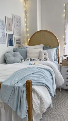 a bedroom with white walls and blue bedding