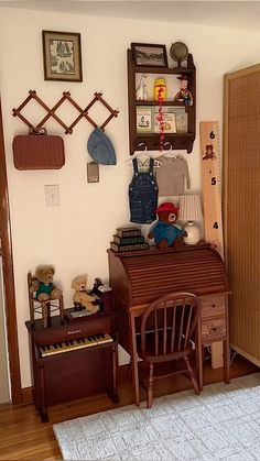 a room with a piano, teddy bear and other items