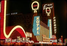 the neon signs are lit up at night in las vegas, nv on dec 1, 2012