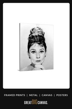 a black and white photo of a woman wearing a tiara with her hand on her chin