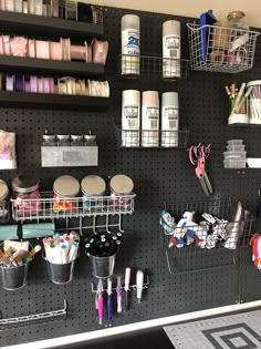 the pegboard is organized with craft supplies