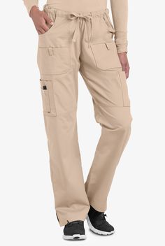 When it comes to pockets for your tools, scissors, pens and more—our women’s scrub cargo pants have no shortage of options. Snap close tabs add fashion and function. Straight leg style is a most-loved look. Each piece in our Butter-soft Stretch scrub collection was designed for 12+ hour shifts, and made from easy-care, 2-way stretch comfort fabric. • Classic fit • Mid-rise • Drawstring, elastic waist • Straight leg • Total of 10 pockets • 2 front pockets • 2 outside pockets with tab • 2 cargo po Cargo Scrub Pants, Scrub Collection, 12 Hour Shifts, Pink Scrubs, Easy Stretches, Medical Uniforms, Iced Latte, Scrub Pants, Scrub Tops