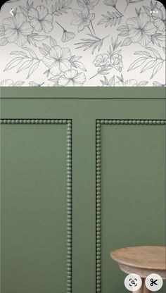 an image of a green cabinet with flowers on the top and numbers on the bottom