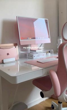 an apple computer sitting on top of a desk next to a pink mouse and keyboard