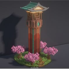 a small tower made out of legos and flowers