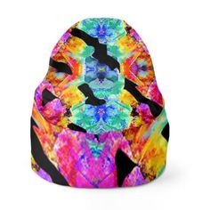 a colorful beanie hat with an abstract design