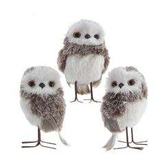 three stuffed owls sitting next to each other