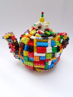 a teapot made out of legos on a white background