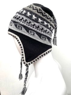 "Unisex Peruvian Alpaca Hat chullo with Earflaps 100% Lining, Soft Fleece Lining Beanie hat, alpaca chullo peruvian hat, peru hat, alpaca hat 100 % Alpaca - High Quality - 100% Lining This is a brand new one of a kind chullo hat made of alpaca, one of the finest yarns in the world. It is soft and warm and features an exquisite intarsia design in a gorgeous color combination. Color combinations are unique due to the handcrafted nature of the product. Order is by main color. Alpaca is considered o Adjustable Alpaca Hat For Outdoor, Alpaca Hat For Outdoor Winter Use, Winter Outdoor Alpaca Hat, Adjustable Alpaca Winter Hat, Winter Alpaca Cap Hats, Winter Alpaca Cap, Adjustable Alpaca Beanie Hat, Adjustable Alpaca Hat With Ear Flaps, Traditional Beanie Hats For Winter