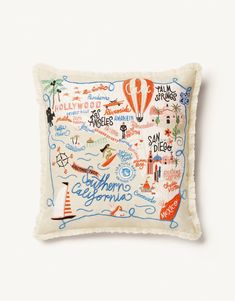 an embroidered pillow with the map of california and other states on it's side