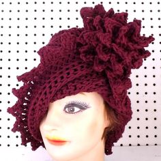 a close up of a mannequin head wearing a hat