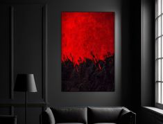 a living room with black walls and a red painting on the wall in front of it