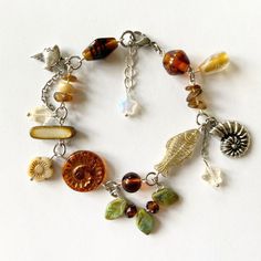 Bracelet Photo Ideas, Goblincore Bracelet, Charm Bracelet Ideas, Charm Ideas, Earthy Jewelry, Whimsical Jewelry, Magical Jewelry, Dragon Jewelry, Funky Jewelry