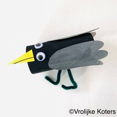 a paper bird made to look like a crow