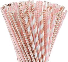 pink and white striped paper straws in a cup